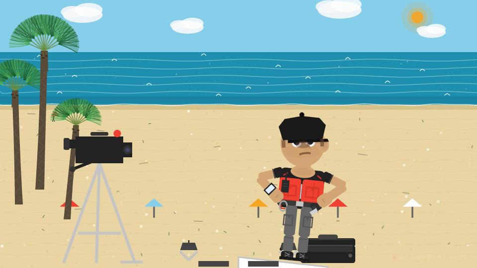 Ralphie standing with arms crossed on the beach set, camera and equipment behind him