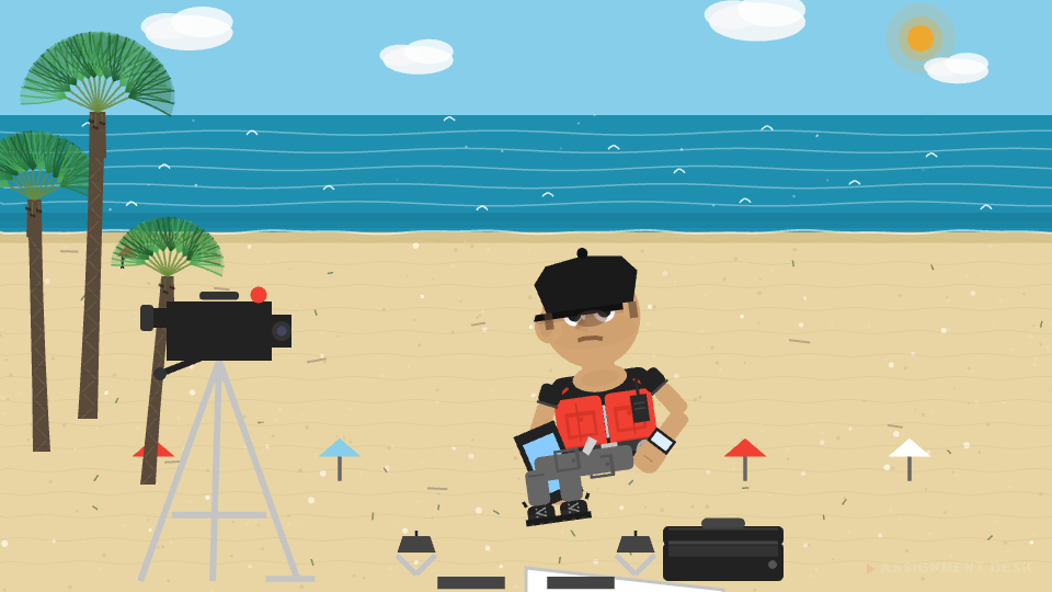 Ralphie scrolling his phone between setups on the beach